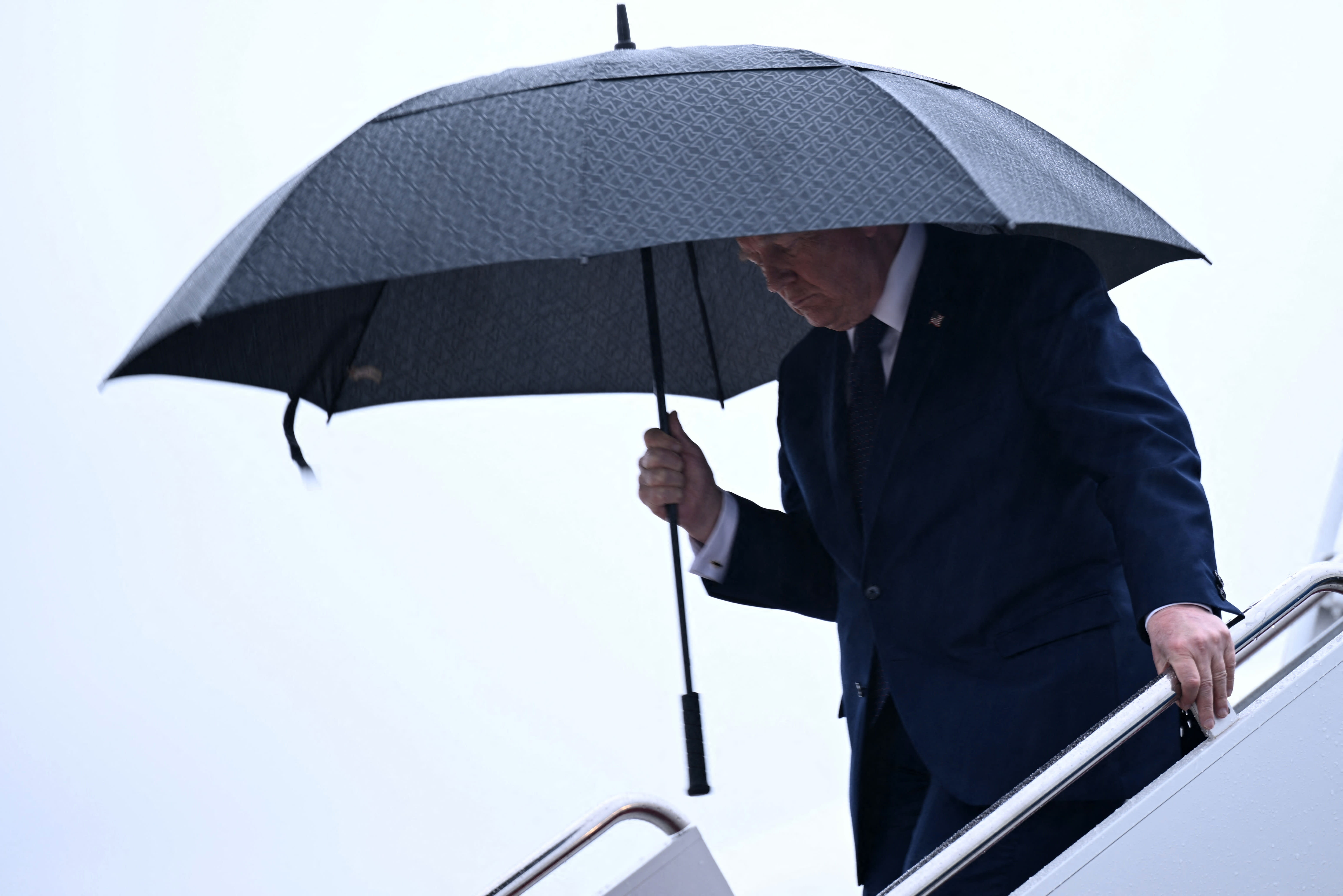 Trump not rushing Iran deal, whacks critics as 'losers'